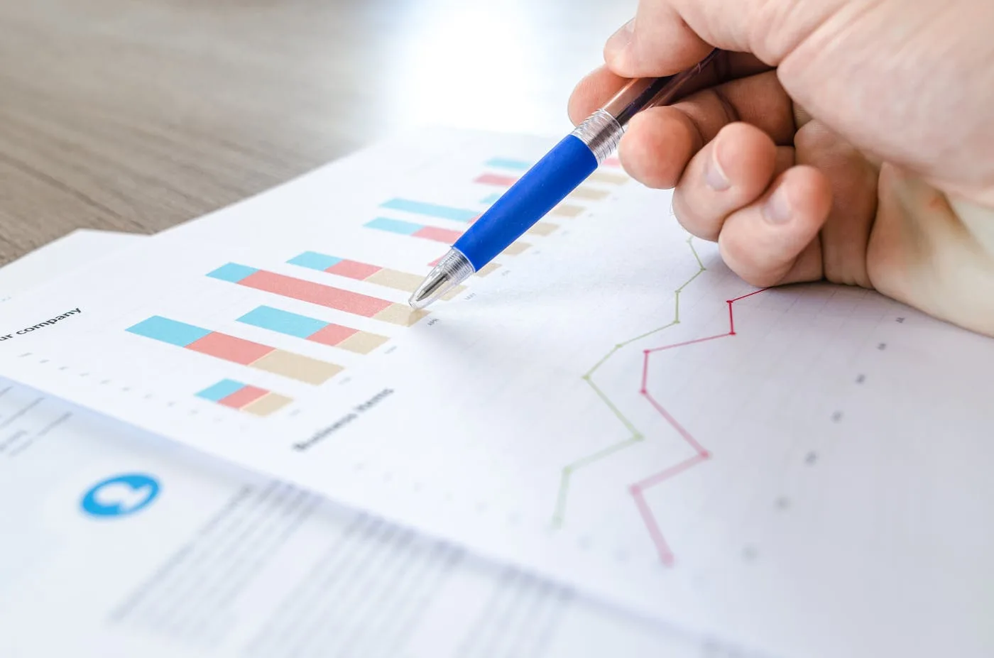 Marketing professional analyzing campaign performance data on a laptop dashboard